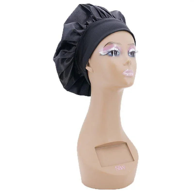 Black silk bonnet for overnight hair protection from Nikki Smith Hair Collection