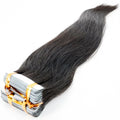 Close-up of straight raw tape-in extensions, showcasing their unprocessed texture and high-quality finish.