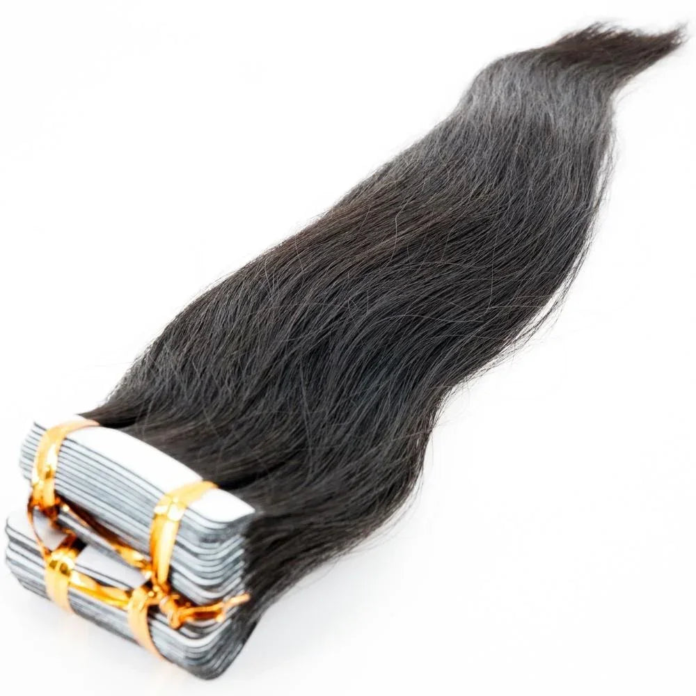 Close-up of straight raw tape-in extensions, showcasing their unprocessed texture and high-quality finish.