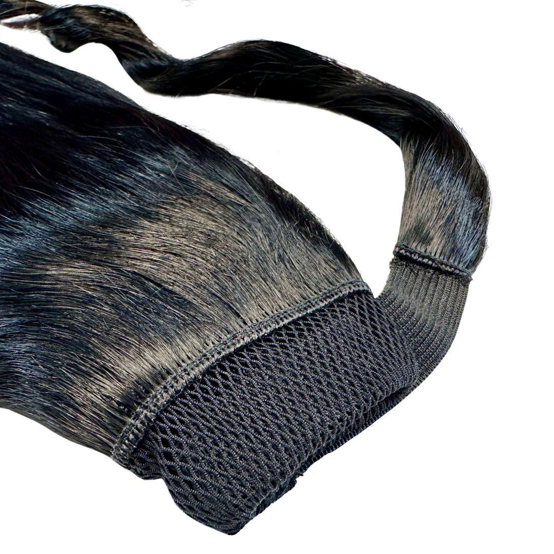 Detailed view of the Jet Black Ponytail, highlighting the natural-looking wrap-around section for a seamless finish.