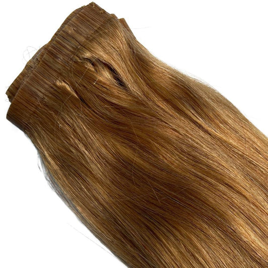 Close-up of Auburn Seamless Clip-In hair extension, showing the fine texture and smooth finish of the 100% human hair.