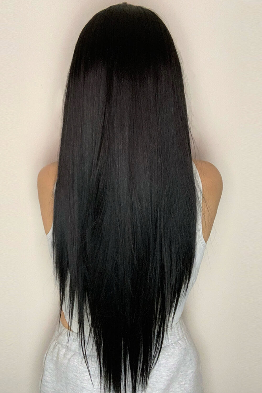 Side view of the 26-inch straight synthetic wig, showcasing its smooth texture and realistic lace front