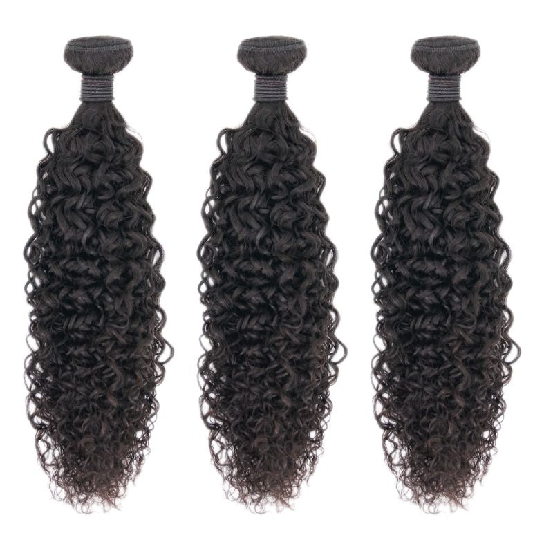 Close-up image of Nikki Smith's Brazilian Kinky Curly hair extensions showcasing the natural, voluminous curls. The extensions are cuticle-aligned, ensuring minimal shedding and thick, full curls from top to bottom.