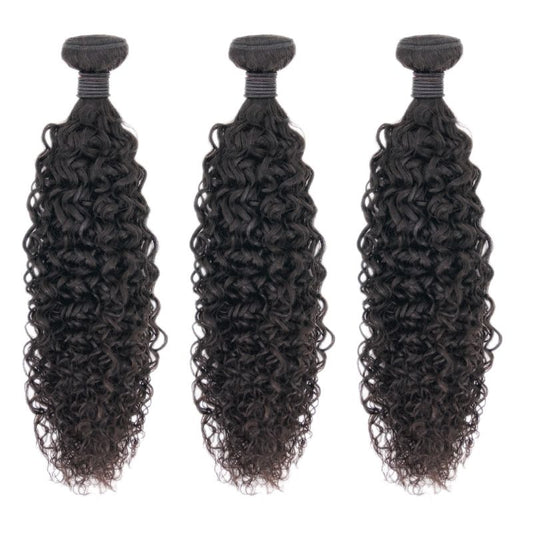 Close-up image of Nikki Smith's Brazilian Kinky Curly hair extensions showcasing the natural, voluminous curls. The extensions are cuticle-aligned, ensuring minimal shedding and thick, full curls from top to bottom.