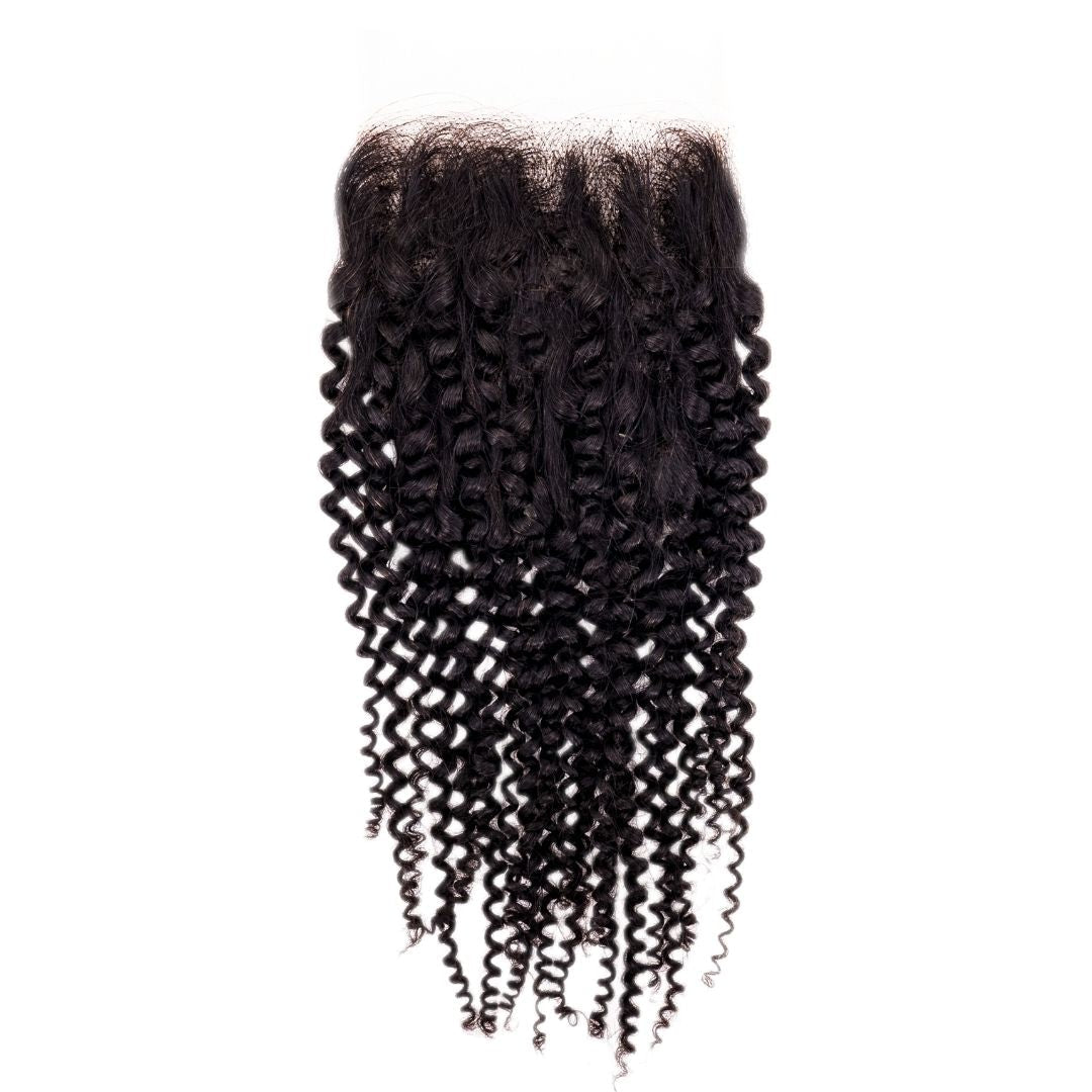 Close-up of Brazilian Afro Kinky Curly Closure, showcasing the natural, tight curls and lace closure, ideal for creating a voluminous, textured look, from Nikki Smith Hair Collection.