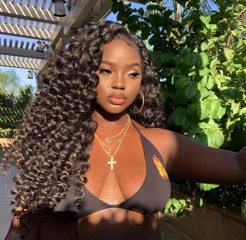Premium hair extensions from Nikki Smith Hair Collection, showcasing various textures and styles including straight, wavy, curly, and body wave options, designed to add volume and luxury to any look.