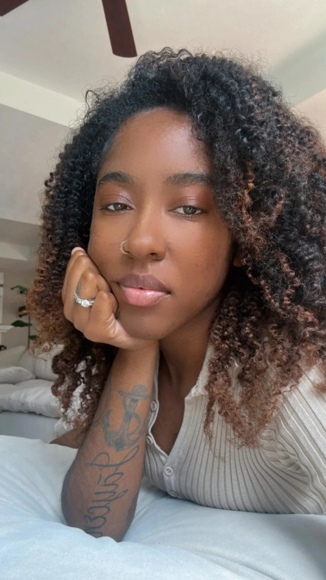 Premium hair extensions from Nikki Smith Hair Collection, showcasing various textures and styles including straight, wavy, curly, and body wave options, designed to add volume and luxury to any look.