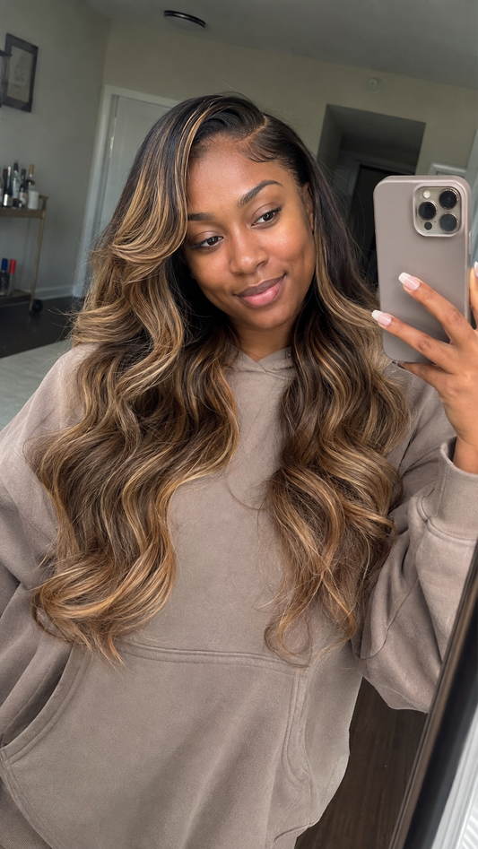 Pre-colored balayage human hair bundles with dark roots and honey blonde highlights styled in long waves