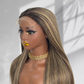 Angled view of a balayage HD lace wig on a mannequin, showing the hairline, dark roots and blonde highlights.