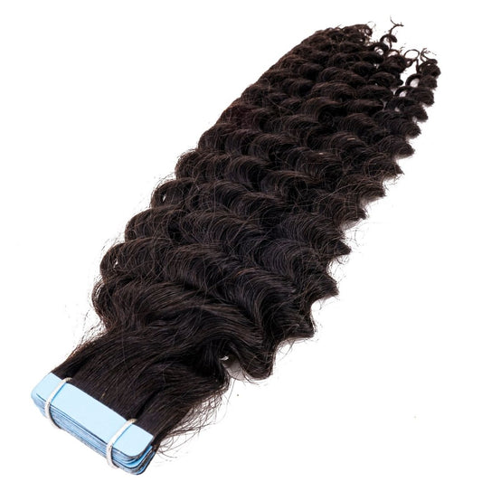 Close-up view of kinky curly tape-in extensions showcasing the natural curl pattern, ideal for 3B to 3C hair types.