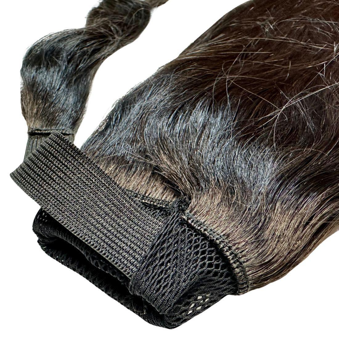 Detailed shot of the Natural Black Ponytail, highlighting the seamless wrap-around feature for a flawless finish.