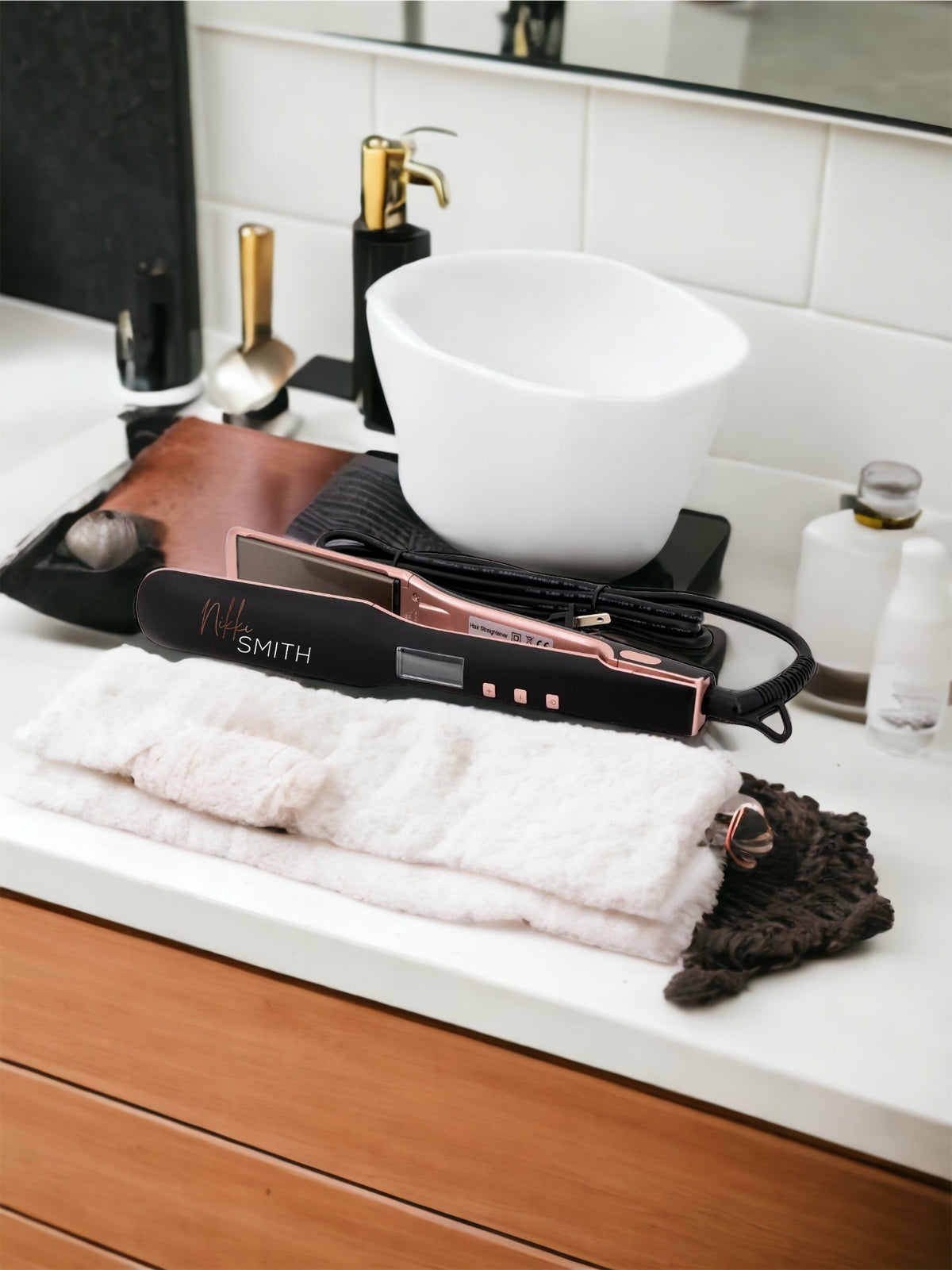 Black and pink Nikki Smith titanium flat iron with wide plates