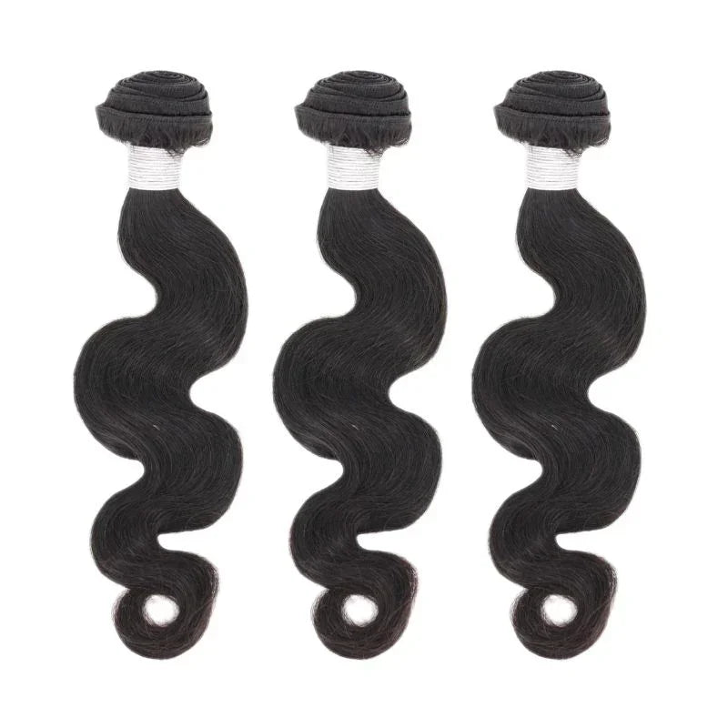 Three bundles of body wave black human hair extensions on white background