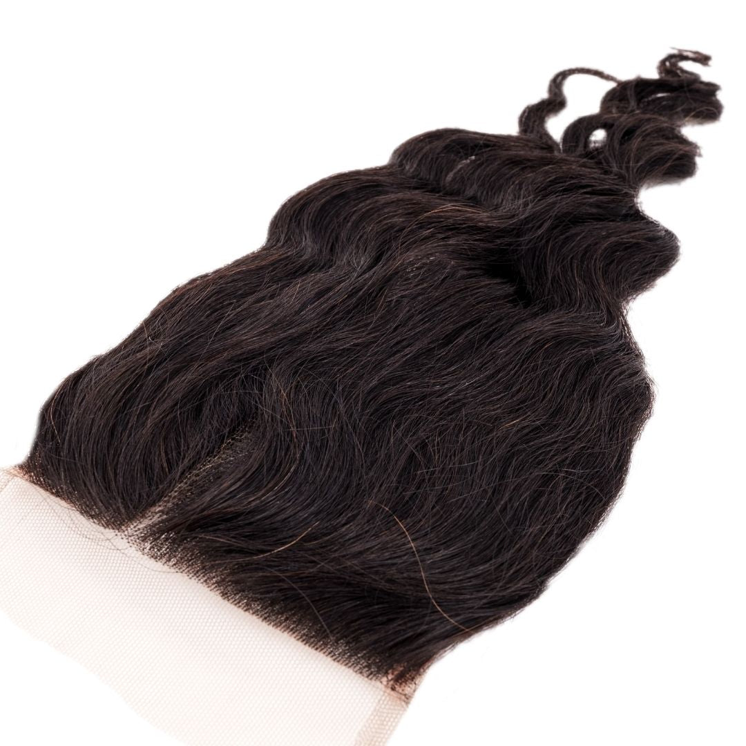 Brazilian Loose Wave 4x4 Transparent Closure with a detailed view of the loose waves and lace.