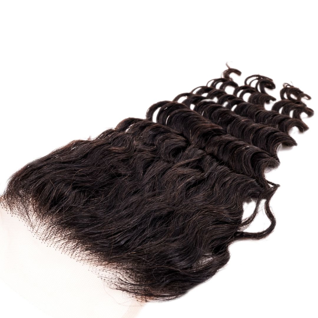Brazilian Deep Wave 4x4 Closure close-up, showing the texture of the deep waves and natural lace.