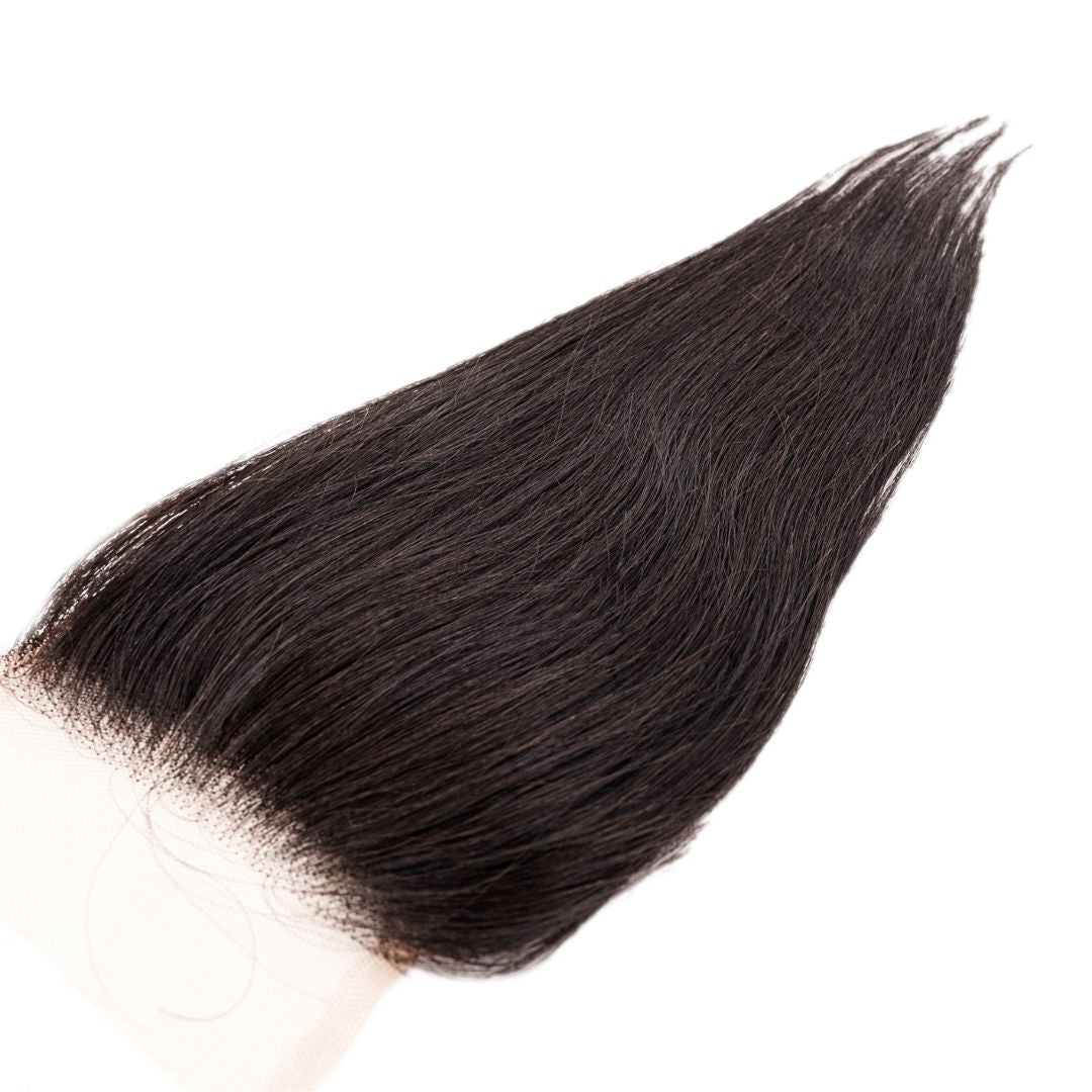 Brazilian Silky Straight 4x4 Transparent Closure close-up showing its natural lace and silky smooth texture.
