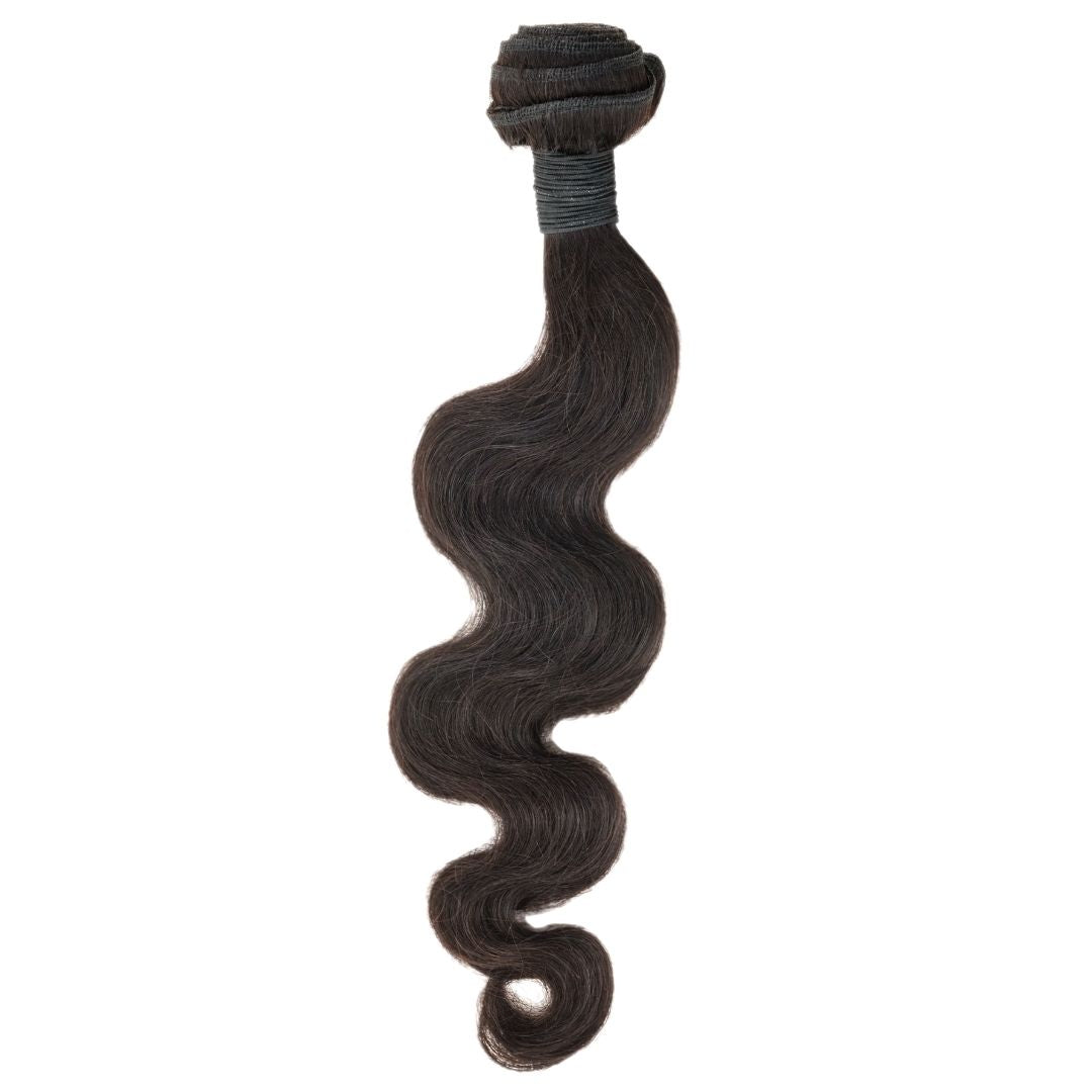 Nikki Smith Hair Collection's Malaysian Body Wave hair, featuring silky waves and lightweight bundles, available in multiple lengths.