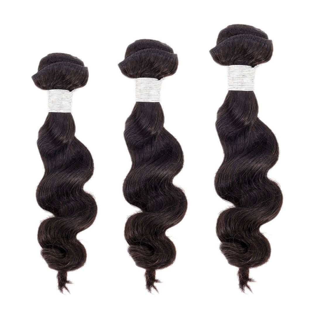 Premium hair extensions from Nikki Smith Hair Collection, showcasing various textures and styles including straight, wavy, curly, and body wave options, designed to add volume and luxury to any look.