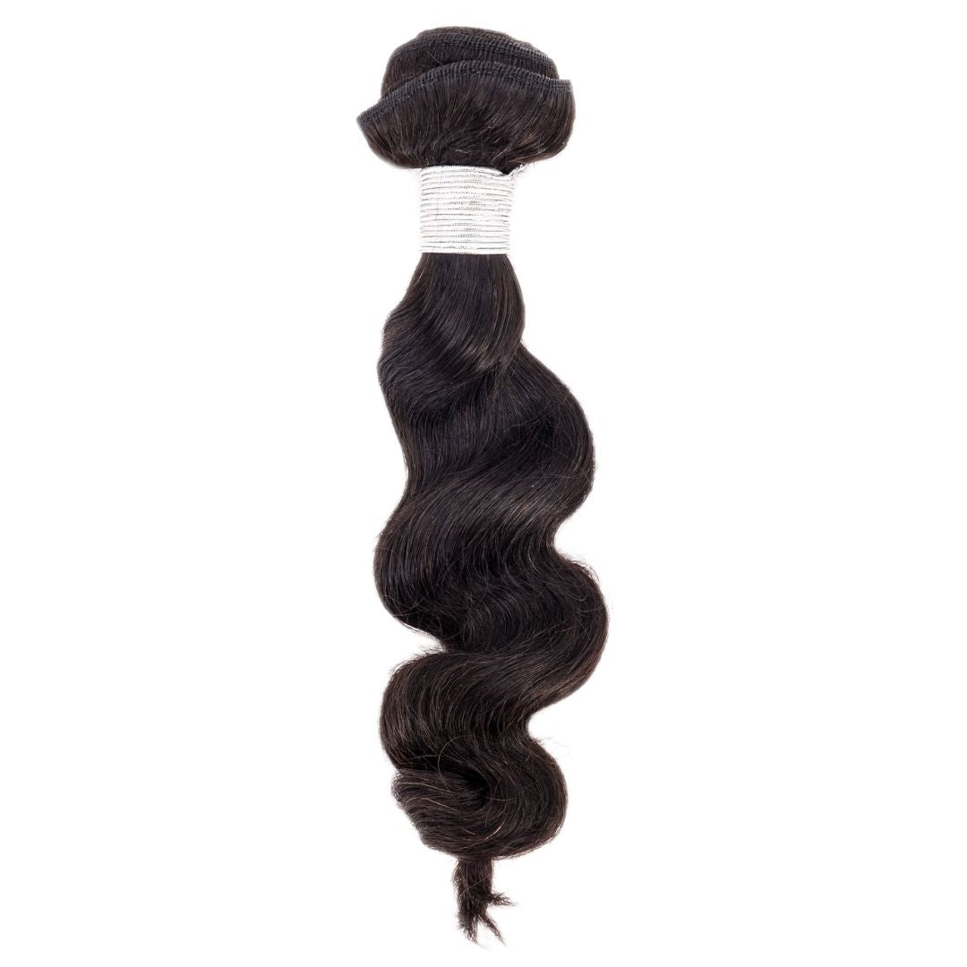 Premium hair extensions from Nikki Smith Hair Collection, showcasing various textures and styles including straight, wavy, curly, and body wave options, designed to add volume and luxury to any look.