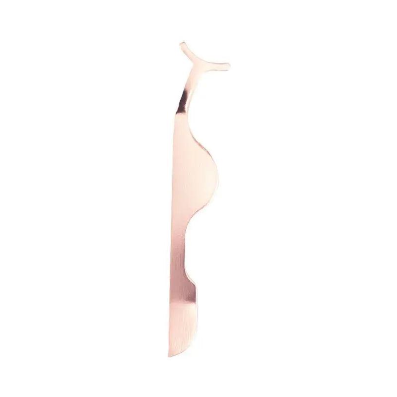 Close-up of Nikki Smith Hair Collection’s lash applicator, showcasing its precision tips for flawless eyelash application.