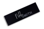 Image focusing on the black and pink design of the titanium flat iron, with a focus on its 1.75-inch plates.
