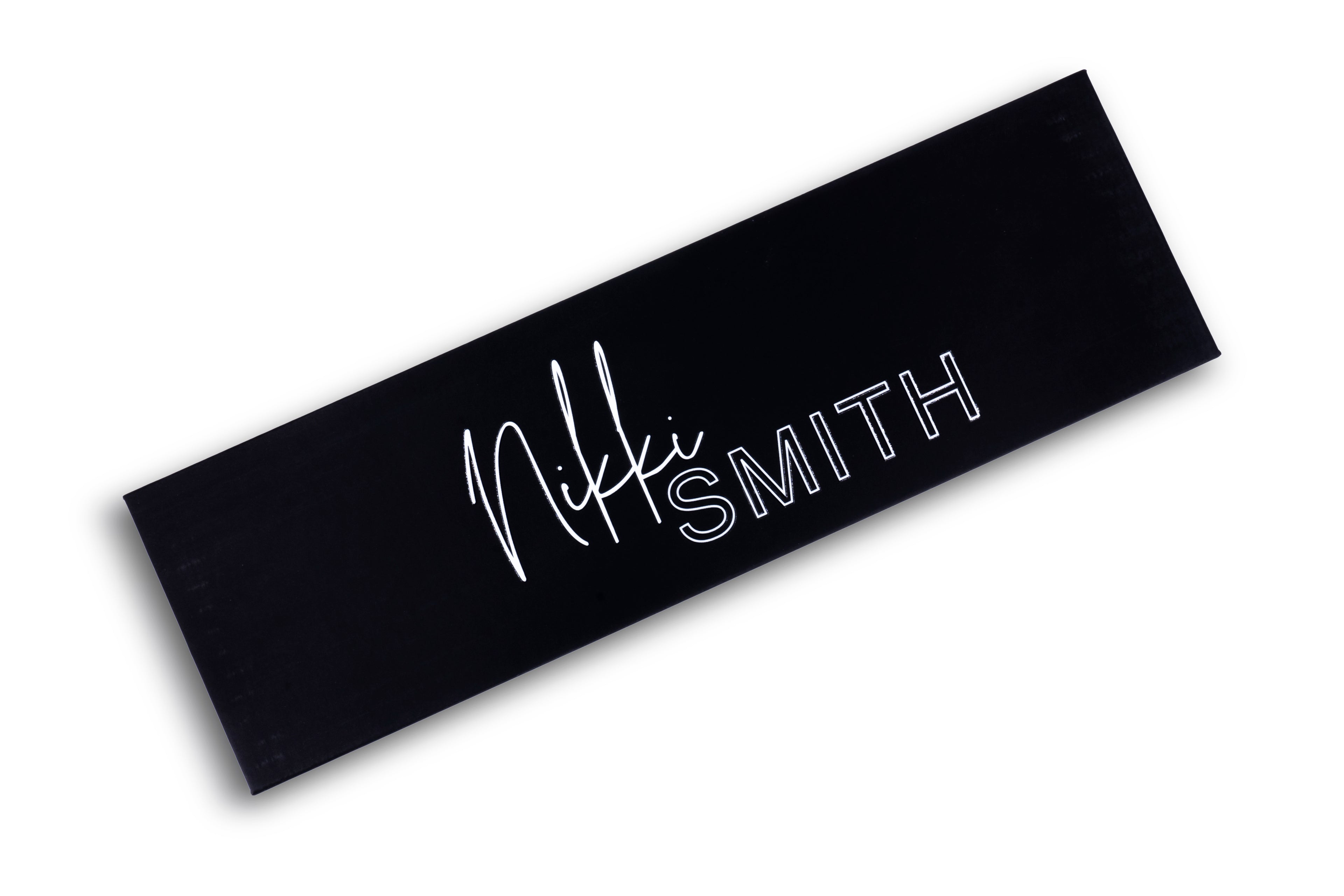 Image focusing on the black and pink design of the titanium flat iron, with a focus on its 1.75-inch plates.